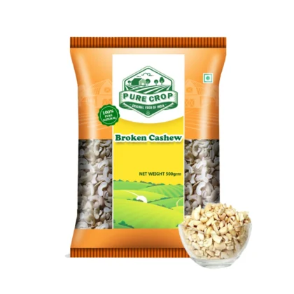 A close-up of light-coloured, irregular pieces of Pure Crop Broken Cashew.